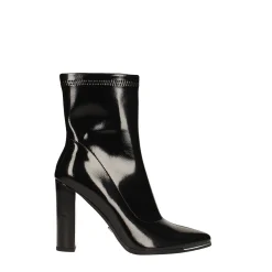 Stivaletti in vernice con profilo metallico in punta. Tacco alto 10.5cm